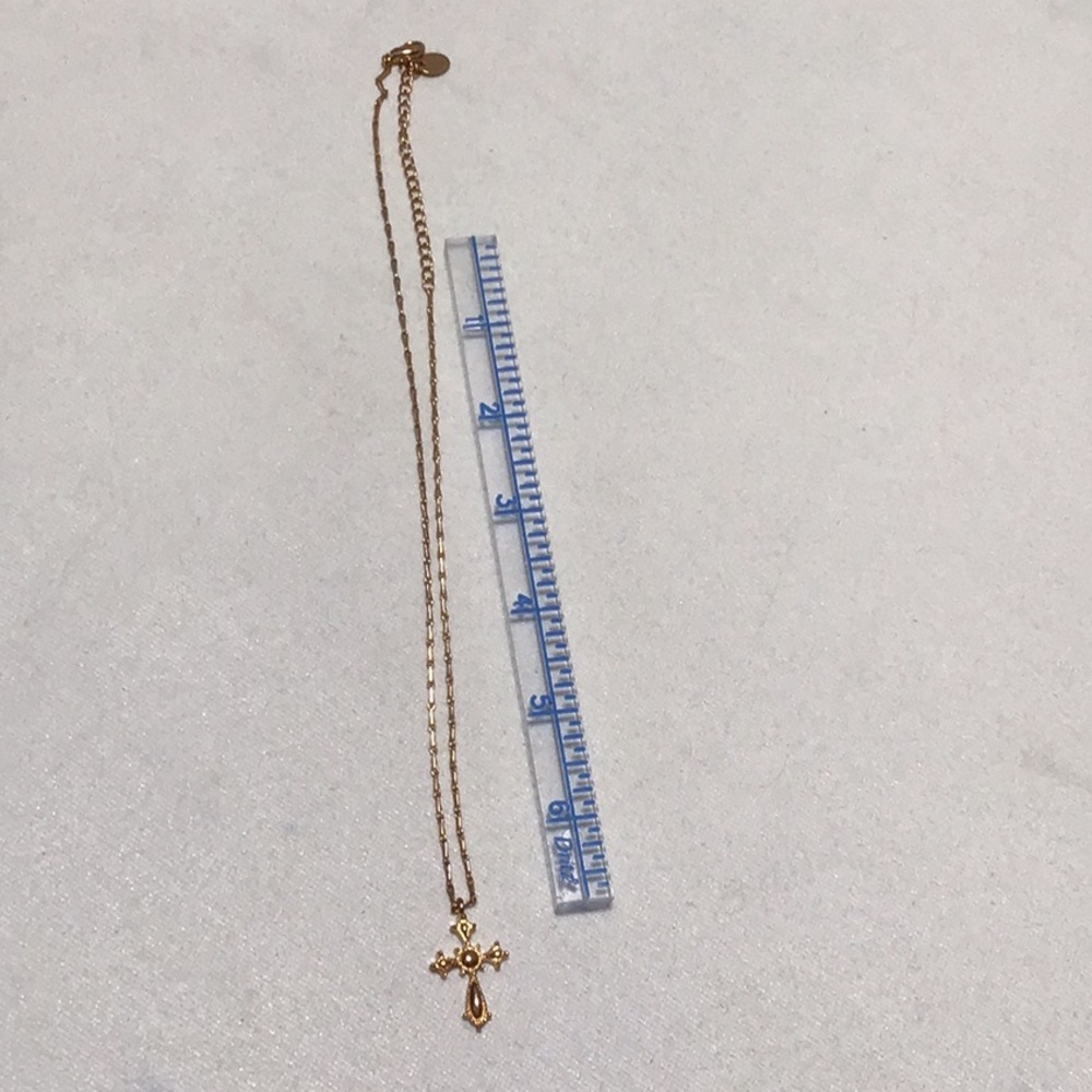 Gold toned cross necklace with chain